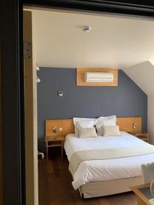 Postel nebo postele na pokoji v ubytování Auberge de Poteaupré