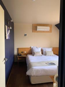 Postel nebo postele na pokoji v ubytování Auberge de Poteaupré