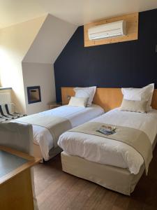 Postel nebo postele na pokoji v ubytování Auberge de Poteaupré