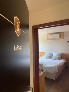 Postel nebo postele na pokoji v ubytování Auberge de Poteaupré