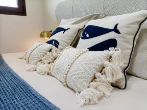A bed or beds in a room at Los Flamencos Vista Playa - 6109