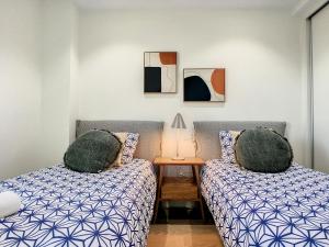 A bed or beds in a room at Los Flamencos Vista Playa - 6109 Még 37 kép