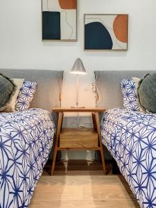 A bed or beds in a room at Los Flamencos Vista Playa - 6109