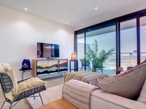 A television and/or entertainment centre at Los Flamencos Vista Playa - 6109
