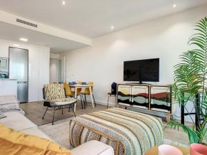 A television and/or entertainment centre at Los Flamencos Vista Playa - 6109