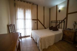Postel nebo postele na pokoji v ubytování Hotel Casa Beletri