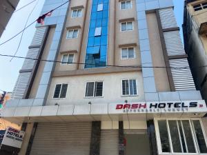 a building with a sign for a hotel at Dash Hotels - Affordable Luxury in Hyderabad