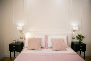 A bed or beds in a room at Viale Italia Boutique Rooms