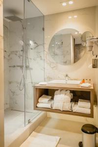 a bathroom with a sink and a shower at Idou Anfa Hôtel & Spa in Casablanca