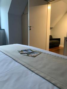 Postel nebo postele na pokoji v ubytování Auberge de Poteaupré