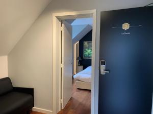 Postel nebo postele na pokoji v ubytování Auberge de Poteaupré