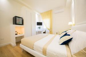A bed or beds in a room at Viale Italia Boutique Rooms
