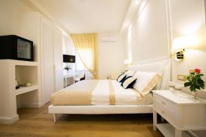 A bed or beds in a room at Viale Italia Boutique Rooms