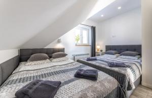 Postel nebo postele na pokoji v ubytování Apartamenty 73