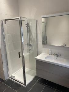 a bathroom with a shower and a sink at The House on the Common in Coity +27 photos