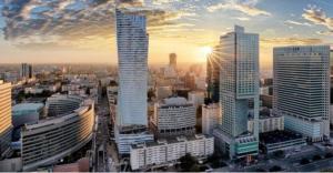 a city skyline with skyscrapers in a city at Warsaw strict center, WiFi, AC, next to central railway station, Złote Tarasy, PKiN, Warszawa ścisłe centrum in Warsaw