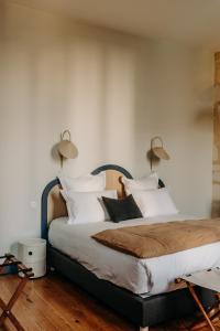 Ein Bett oder Betten in einem Zimmer der Unterkunft B&B Maison Rosa