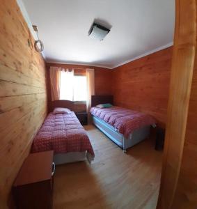 מיטה או מיטות בחדר ב-Casa Country Pucón