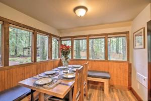 a dining room with a table and chairs and windows at Walk to Zigzag River The Sundance Cottage in Rhododendron +29 photos