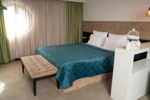 Postel nebo postele na pokoji v ubytování Akacija Luxury Suites