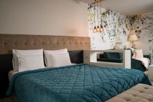 Postel nebo postele na pokoji v ubytování Akacija Luxury Suites