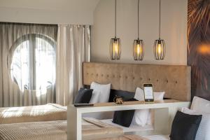 Postel nebo postele na pokoji v ubytování Akacija Luxury Suites