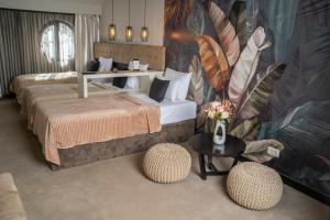 Postel nebo postele na pokoji v ubytování Akacija Luxury Suites