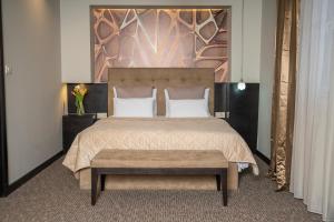 Postel nebo postele na pokoji v ubytování Akacija Luxury Suites