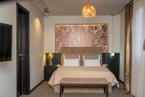 Postel nebo postele na pokoji v ubytování Akacija Luxury Suites