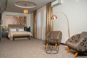 Postel nebo postele na pokoji v ubytování Akacija Luxury Suites