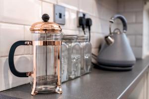 a glass jug on a counter in a kitchen at Charming & Central House with Garden and Free Parking in Beverley