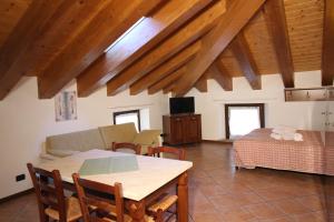 a living room with a table and a couch at Residence Aquila - Mono Corno Vitello in Brusson