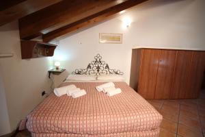 Postel nebo postele na pokoji v ubytování Residence Aquila - Mono Corno Vitello