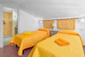 Postel nebo postele na pokoji v ubytování Gli Ulivi Palau - Lu Maccioni
