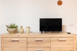Telewizja i/lub zestaw kina domowego w obiekcie Gli Ulivi Palau - Lu Maccioni