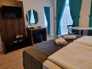 Postel nebo postele na pokoji v ubytování A&F Hotel Chemnitz