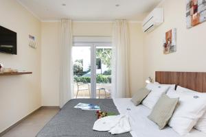 a bedroom with a bed and a sliding glass door at LUXURY VILLA GOGA in Novalja
