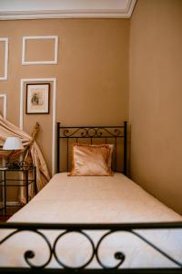 A bed or beds in a room at La Foresteria di Palazzo Picedi Benettini