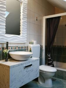 Koupelna v ubytování Apartmani Sunset + 37 fotografií