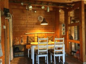 a dining room with a table and two chairs at Ferienhaus Bergglück in Nonnweiler