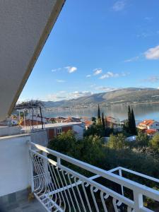 a balcony with a view of a body of water at apartmentivanka in Trogir