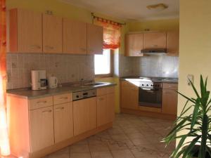 A cozinha ou cozinha compacta de Appartements Gillmeier Herta
