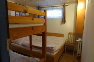 Un ou plusieurs lits dans un hébergement de l'établissement Apartmány u Bernardů