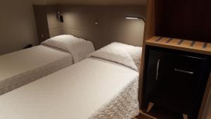 Katil atau katil-katil dalam bilik di Plaza Spania Boutique Hotel