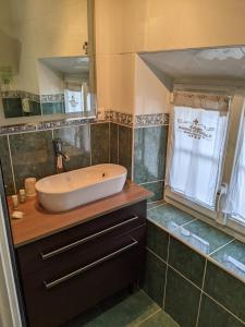 a bathroom with a tub and a sink and a shower at Domaine De Moresville in Flacey