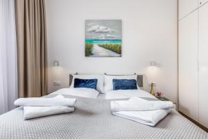 Posteľ alebo postele v izbe v ubytovaní Seaside Apartamenty - Olimpijska 2 Mielno - Sauna & Fitness & Parking - w cenie pobytu