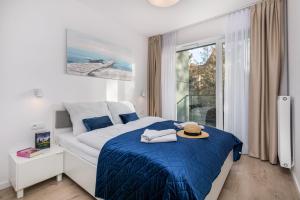 Posteľ alebo postele v izbe v ubytovaní Seaside Apartamenty - Olimpijska 2 Mielno - Sauna & Fitness & Parking - w cenie pobytu