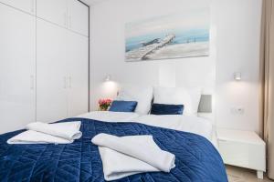 Posteľ alebo postele v izbe v ubytovaní Seaside Apartamenty - Olimpijska 2 Mielno - Sauna & Fitness & Parking - w cenie pobytu