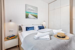 Posteľ alebo postele v izbe v ubytovaní Seaside Apartamenty - Olimpijska 2 Mielno - Sauna & Fitness & Parking - w cenie pobytu