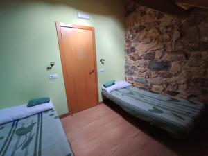 Postel nebo postele na pokoji v ubytování Albergue El Rebezo